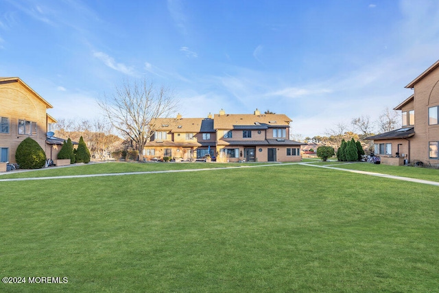 view of front of home with a front lawn