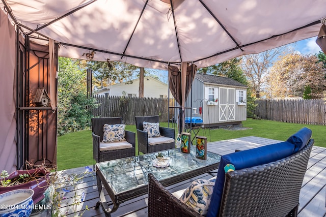 exterior space featuring a deck, a shed, and a gazebo