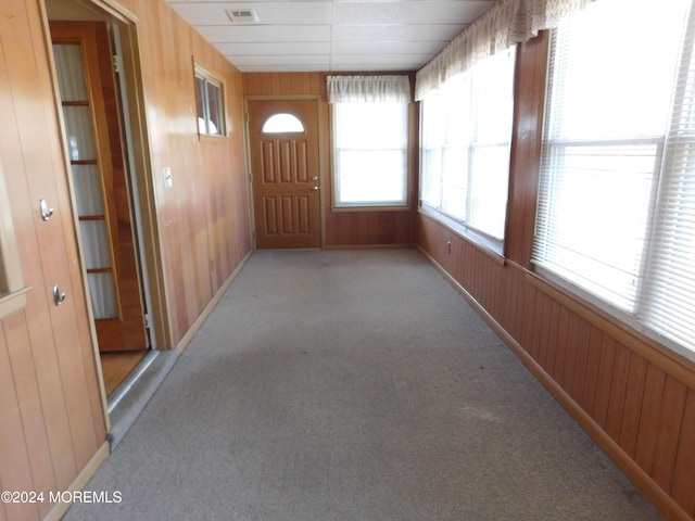 unfurnished sunroom featuring a paneled ceiling