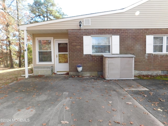 rear view of house featuring a patio