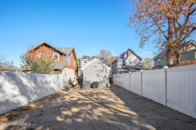 view of yard with central AC