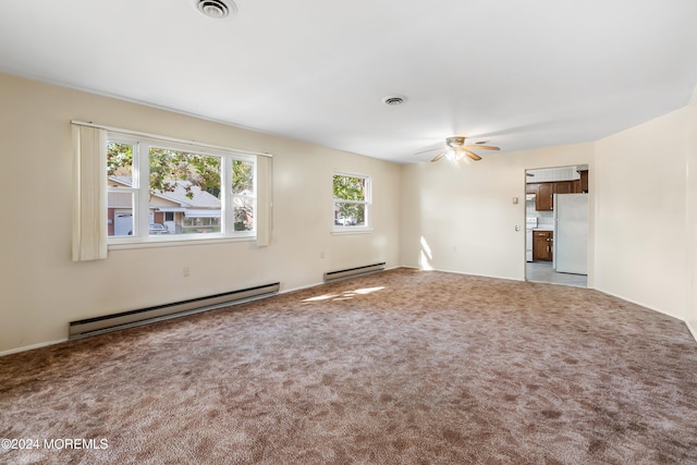 unfurnished living room featuring light carpet, baseboard heating, and ceiling fan