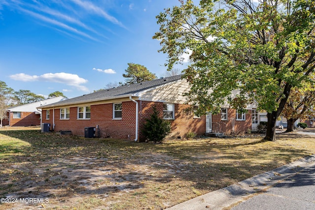 view of home's exterior featuring central AC unit