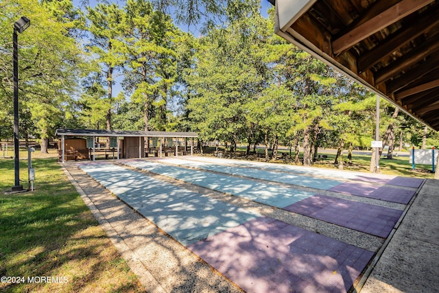 view of pool with a lawn