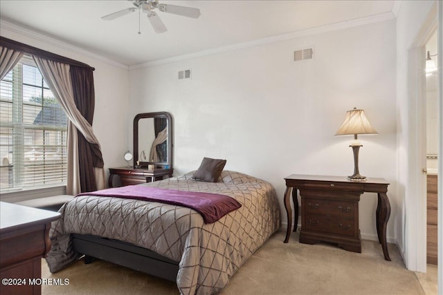 carpeted bedroom featuring ensuite bathroom, ceiling fan, and crown molding