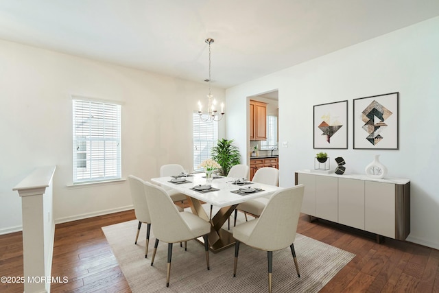 dining area with baseboards, a notable chandelier, and dark wood-style flooring