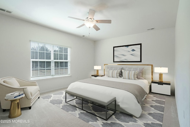 bedroom featuring visible vents, baseboards, ceiling fan, and carpet floors