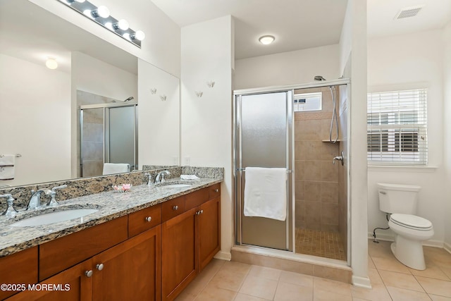 full bathroom with tile patterned floors, visible vents, and a sink