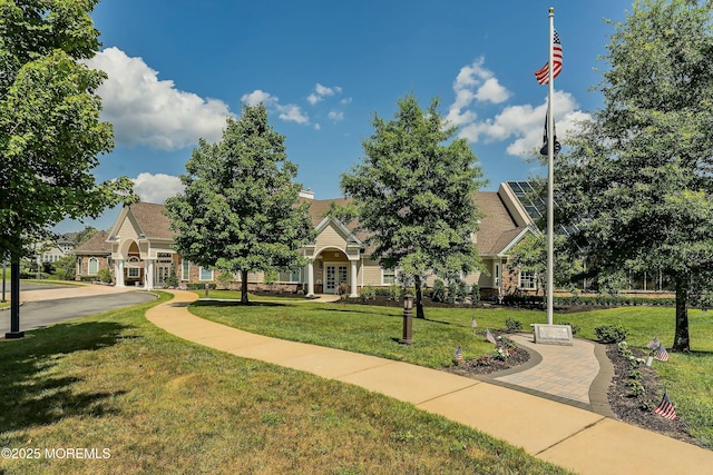 view of home's community with a yard