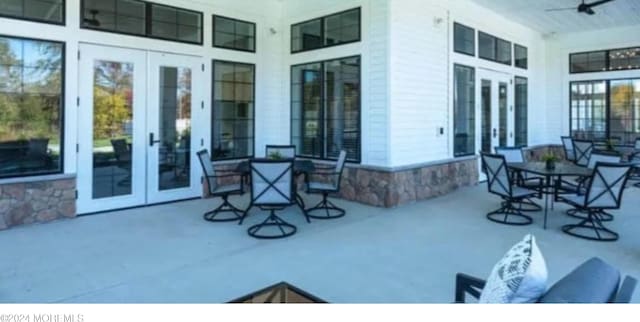 view of patio with french doors and a porch