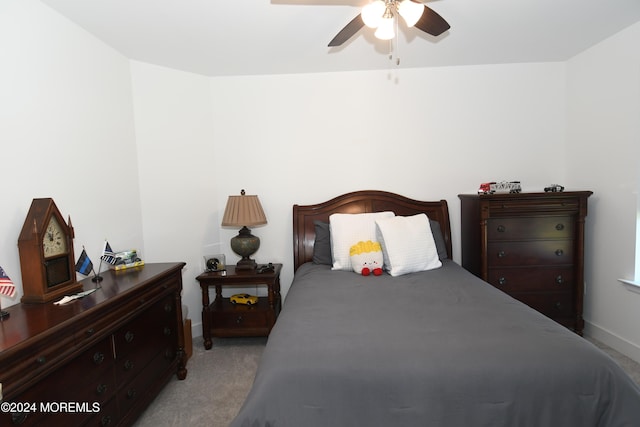 bedroom featuring light carpet and ceiling fan