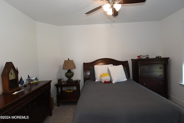 bedroom featuring ceiling fan and carpet