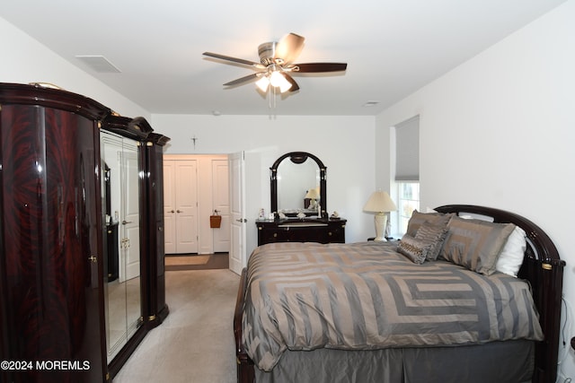 carpeted bedroom featuring ceiling fan