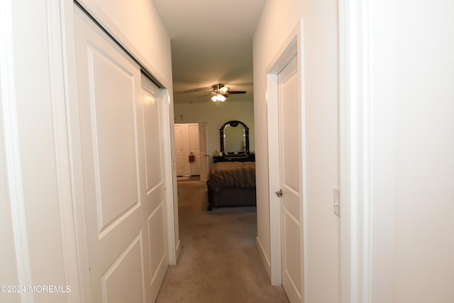 hallway with light colored carpet