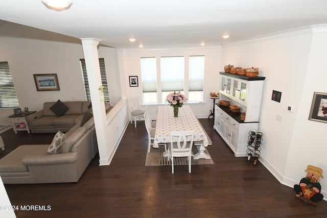 dining area featuring ornamental molding, decorative columns, and dark hardwood / wood-style floors