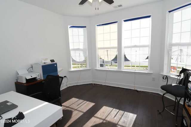 office with dark hardwood / wood-style floors and ceiling fan