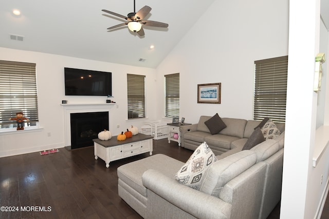 living room featuring ceiling fan, high vaulted ceiling, and dark hardwood / wood-style flooring