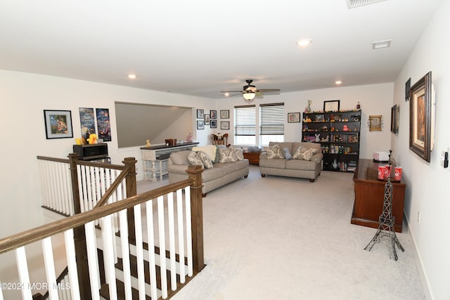 living room featuring ceiling fan and light carpet