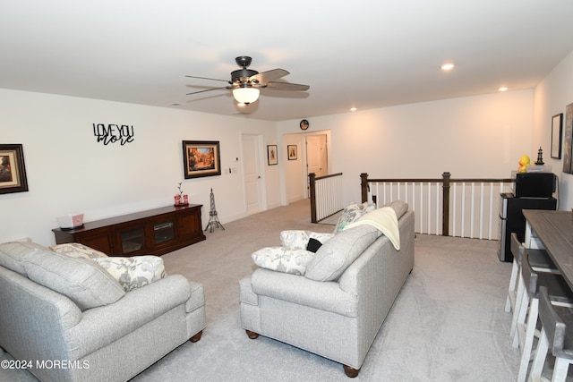 living room featuring ceiling fan and light carpet