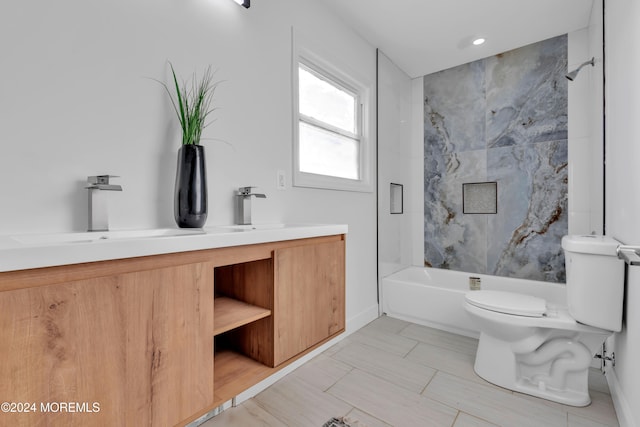 full bathroom with vanity, toilet, and tiled shower / bath combo