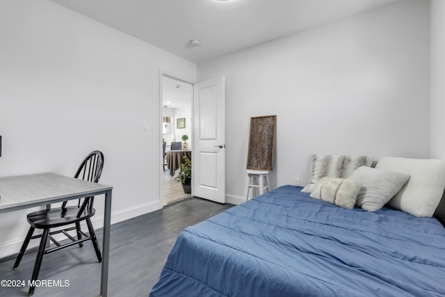 bedroom featuring dark hardwood / wood-style flooring