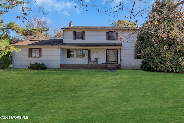 view of front facade with a porch and a front lawn