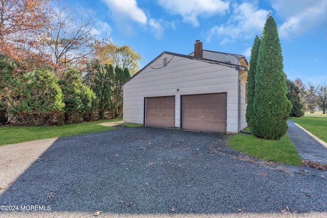 garage featuring a yard