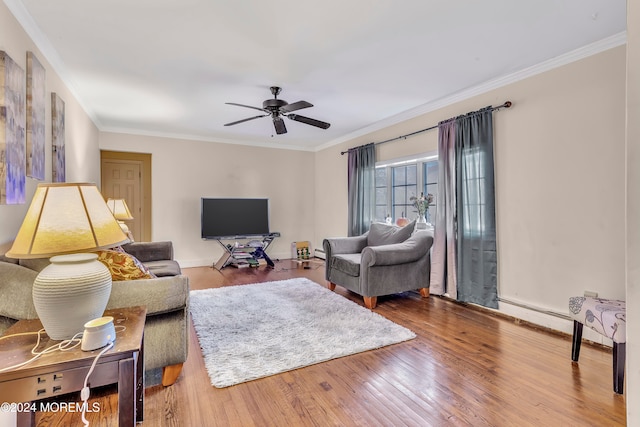 living room featuring crown molding, hardwood / wood-style floors, and ceiling fan