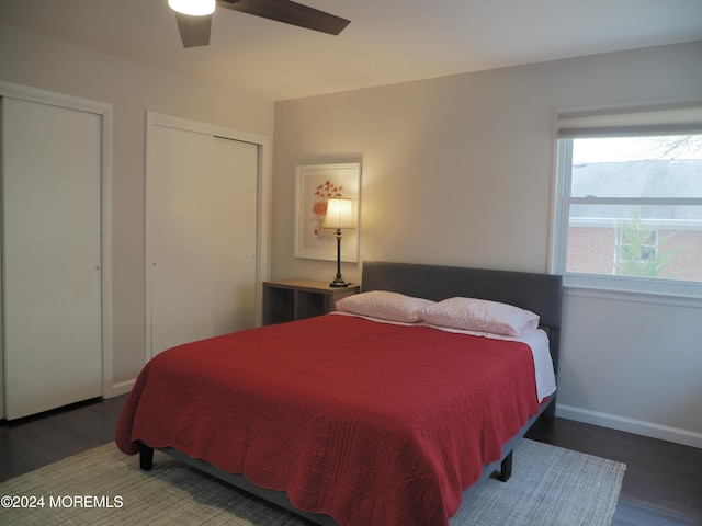 bedroom with dark hardwood / wood-style floors and ceiling fan