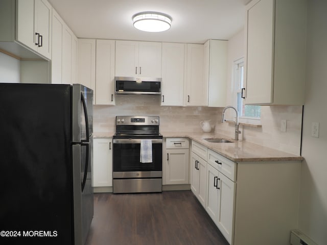 kitchen featuring baseboard heating, white cabinetry, sink, and appliances with stainless steel finishes