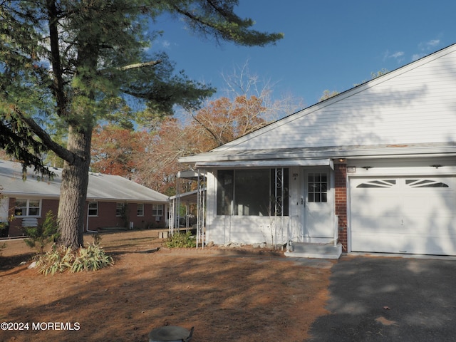 view of side of home featuring a garage