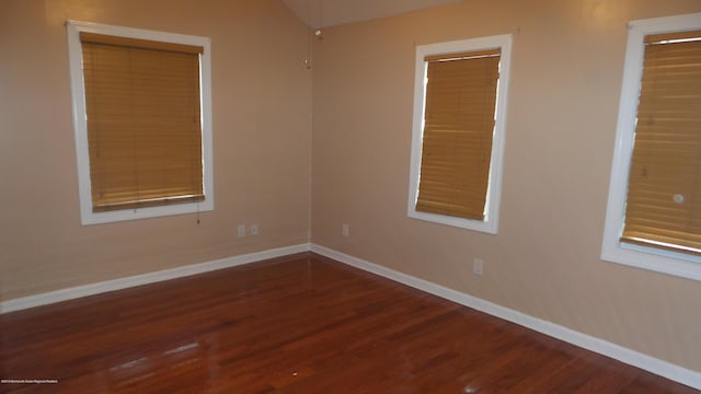 unfurnished room featuring hardwood / wood-style flooring