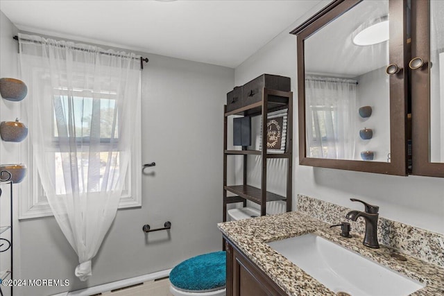 bathroom with vanity and toilet