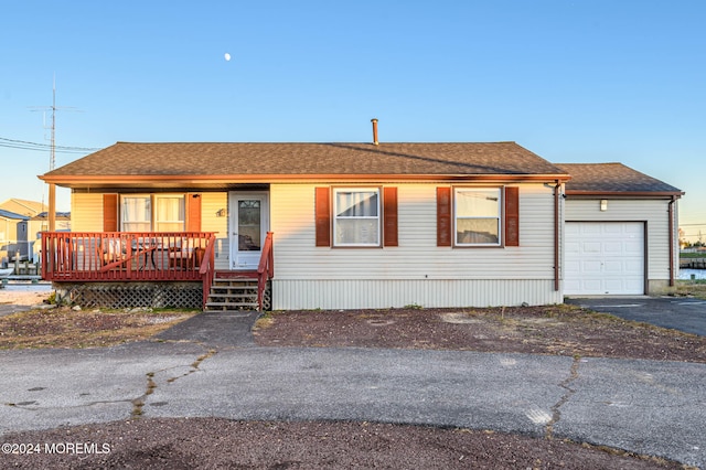 view of front of home featuring covered porch and a garage