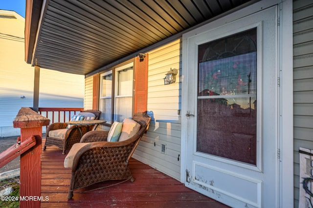 wooden terrace featuring a porch