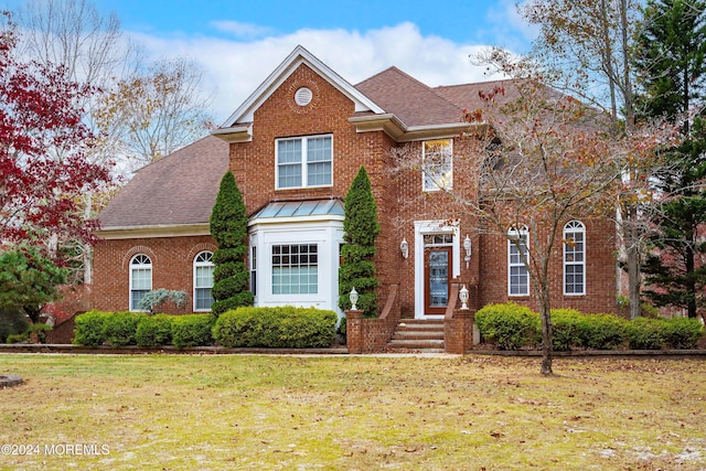 view of front property with a front yard