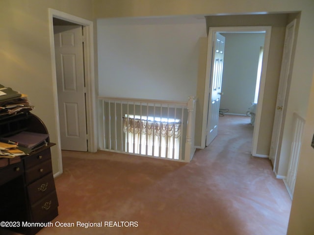 corridor with light colored carpet