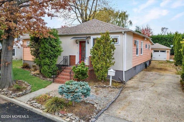 view of front of home featuring an outbuilding and a garage