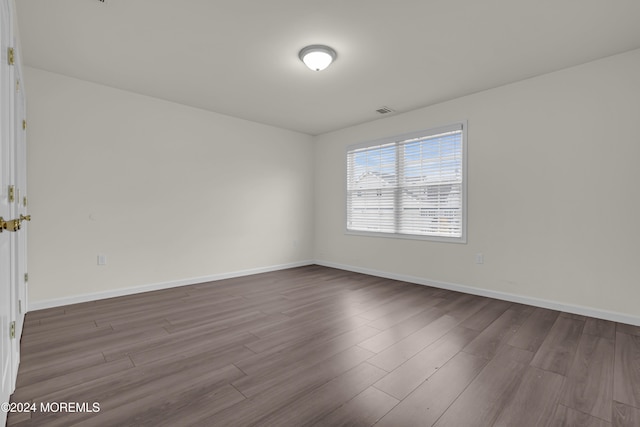 unfurnished room featuring hardwood / wood-style floors