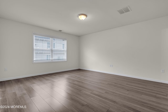 spare room featuring hardwood / wood-style flooring