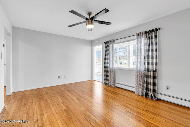 unfurnished room featuring light wood-style floors, baseboards, and a ceiling fan