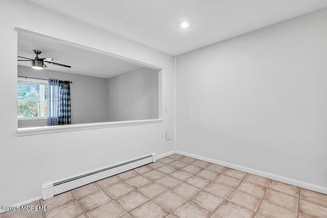 spare room with baseboards, a baseboard heating unit, and ceiling fan