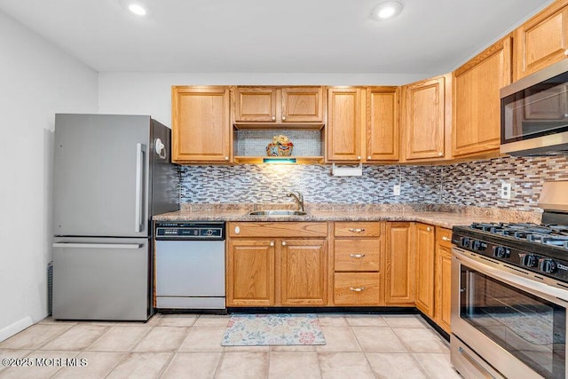 kitchen with open shelves, appliances with stainless steel finishes, backsplash, and a sink