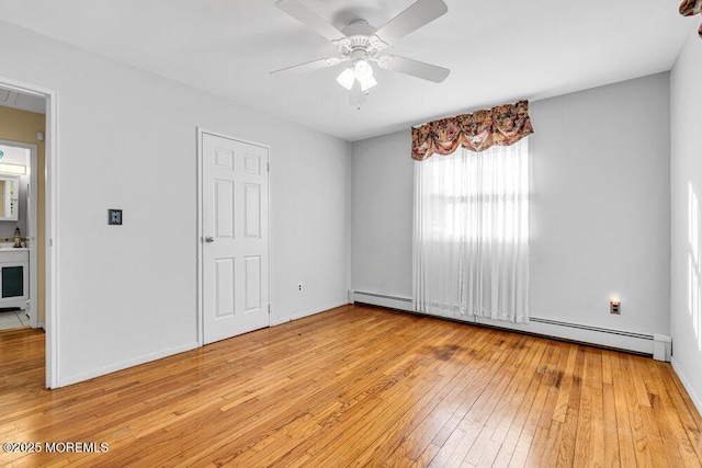 unfurnished bedroom with light wood-type flooring, baseboards, baseboard heating, and a ceiling fan