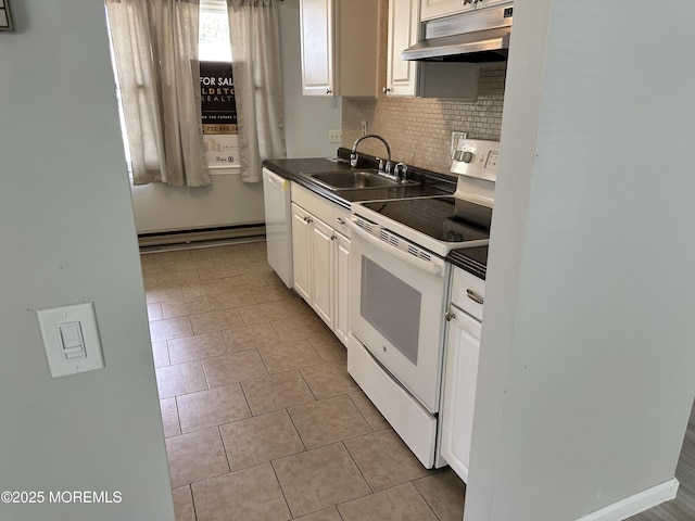 69 Chelsea Dr Unit 72, Manchester, NJ 08759 - kitchen featuring white appliances, under cabinet range hood, a sink, decorative backsplash, and white cabinetry
