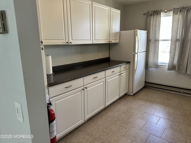 69 Chelsea Dr Unit 72, Manchester, NJ 08759 - kitchen with dark countertops, healthy amount of natural light, and white cabinets