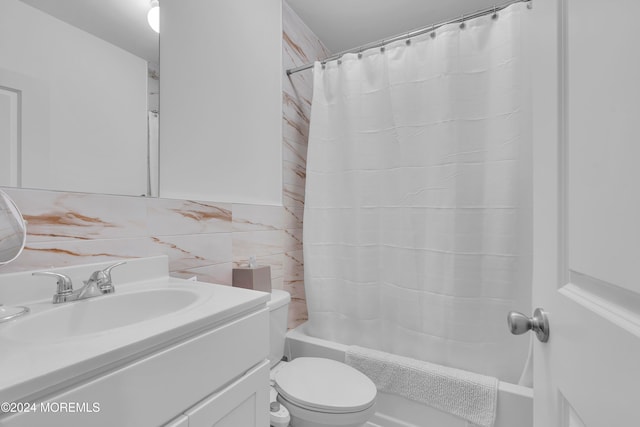 full bathroom featuring vanity, toilet, shower / bathtub combination with curtain, tile walls, and tasteful backsplash