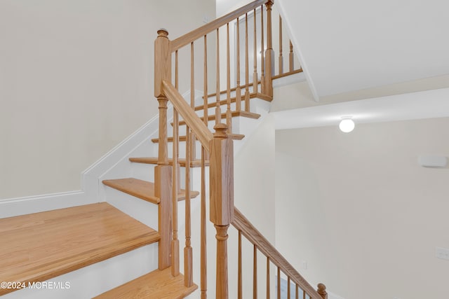 stairway with wood-type flooring