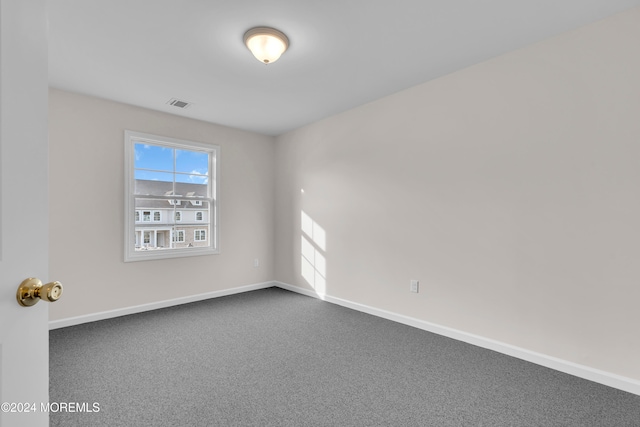 unfurnished room featuring carpet flooring