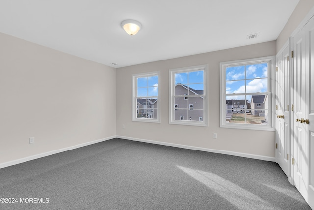 empty room featuring carpet flooring